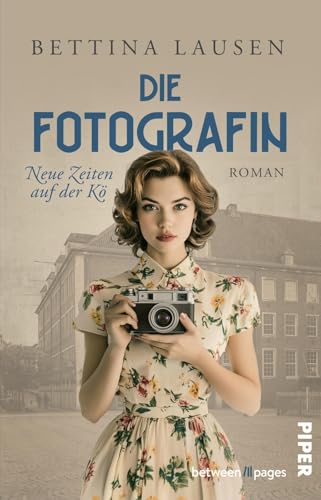 Neue Zeiten auf der Kö – Die Fotografin (Düsseldorf-Saga 2): Roman | Eine junge Frau zwischen Liebe und Schuld von between pages by Piper